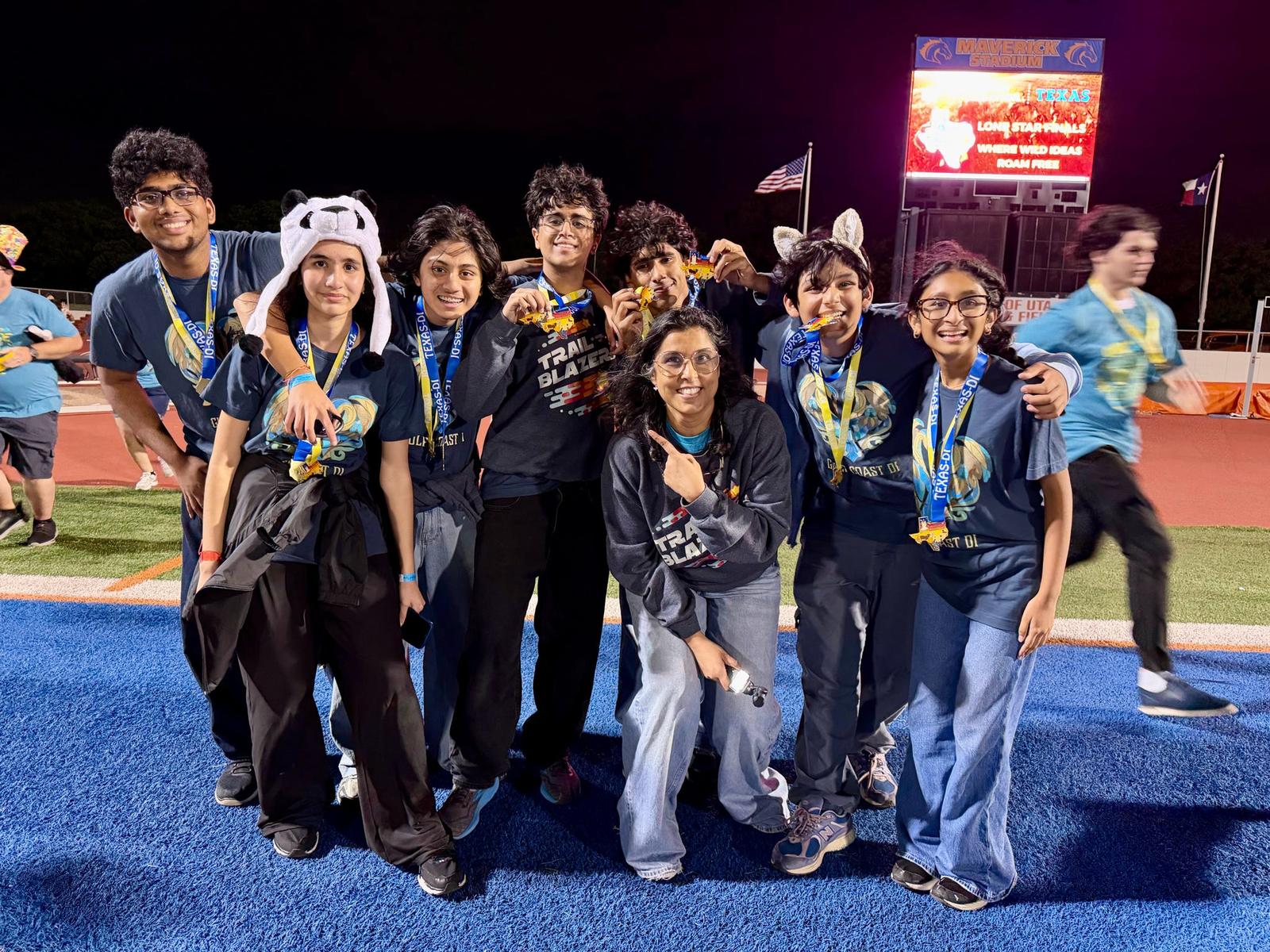 Team celebrating with medals at Lone Star Finals